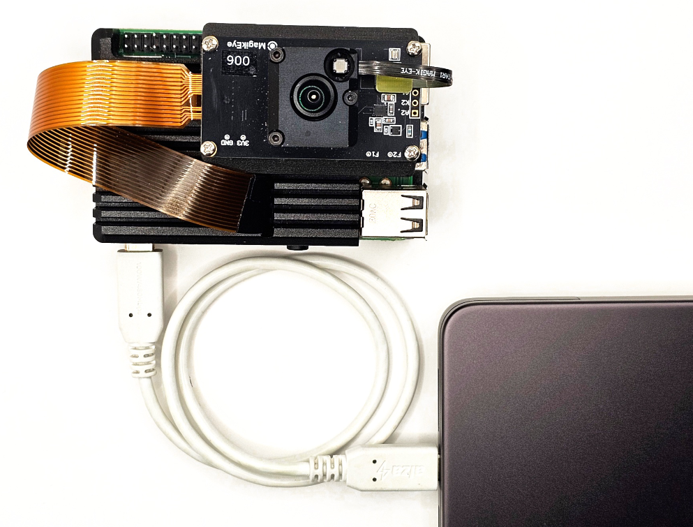 ILT006 and Raspberry Pi 4 connected to a laptop over a single USB-C cable